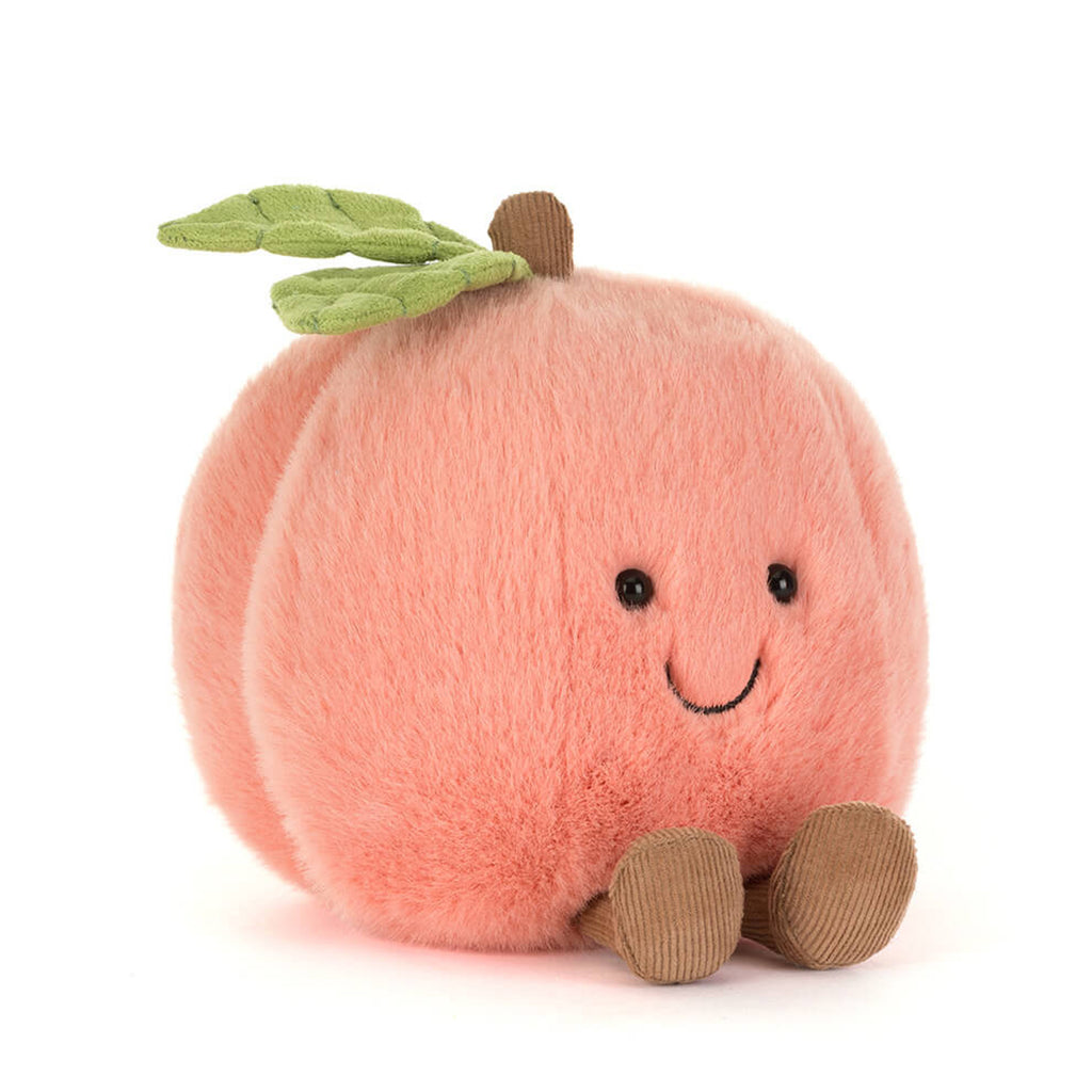 A soft, kawaii-style plush toy in the shape of a smiling peach, known as the Peachy Plush Buddy.