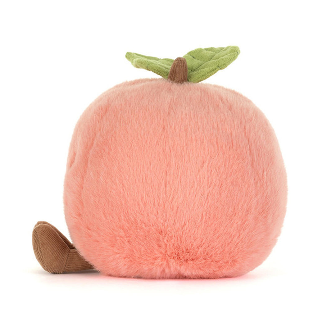 A soft, kawaii-style plush toy in the shape of a smiling peach, known as the Peachy Plush Buddy.