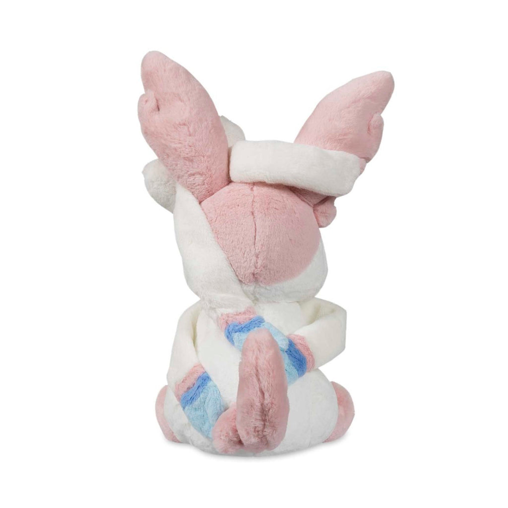 Sylvia Sylveon Comfy Friends plush officially licensed Pokémon Eevee evolution stuffed animal. Ultra-soft premium chenille fabric cloud-like texture sensory comfort toy. Pastel pink coloring safety embroidered eyes perfect for emotional support anxiety relief. Comfy Friends collection limited edition Pokémon Center product. Best gift for Pokémon fans children adults birthday Christmas present. Huggable design soft stuffed toy collectible merchandise cuddling companion.